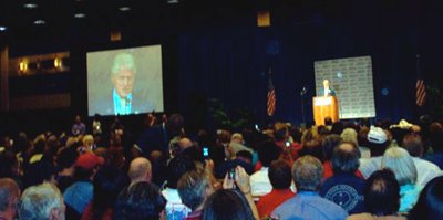 President Clinton addresses the meeting.
